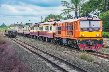 Passenger train by diesel locomotive on the railway.