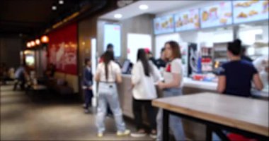 Time Lapse video of People Walking and Ordering from a Fast Food restaurant. Blurred background 4K video