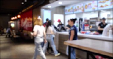 People Walking and Ordering from a Fast Food restaurant. Blurred background 4K video