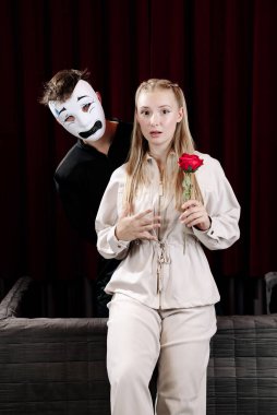 A pantomime scene between two actors expressing the emotion of fear. Close-up.