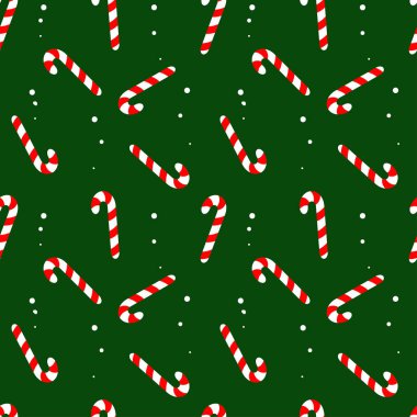 Noel ve Yeni Yıl düz stil. Yeşil arka planda noel şekerlerinin kusursuz dokusu. Şeker kamışı.