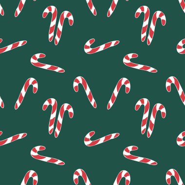 Noel ve Yeni Yıl modeli el yapımı. Koyu yeşil bir arka planda kusursuz bir Noel şekeri dokusu. Şeker kamışı..