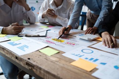 Asian business adviser meeting to analyze and discuss the situation on the business plan in the meeting room. Investment Consultant, Financial advisor and accounting concept.