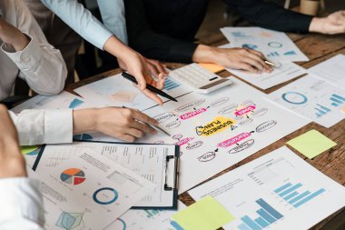 Asian business adviser meeting to analyze and discuss the situation on the business plan in the meeting room. Investment Consultant, Financial advisor and accounting concept.