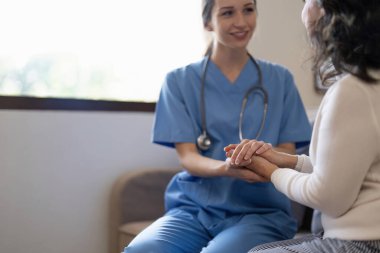 Nurse, hands and senior patient in empathy, safety and support of help, trust and healthcare consulting. Nursing home, counseling and gratitude for medical caregiver, client and hope in consultation.