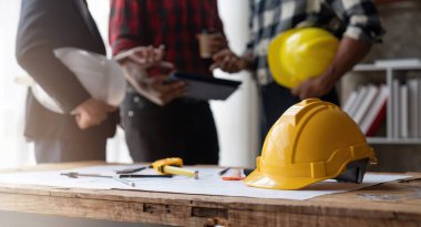 Team engineer man working with laptop and inspection for architectural plan,sketching a construction project.