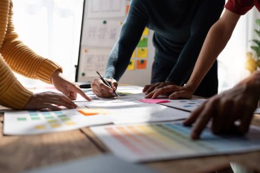 Close up view of brainstorm team of creative Web Graphic Designer ux developer and ui designer brainstorming about mobile app interface wireframe design.