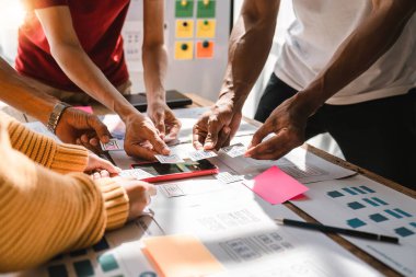 Brainstorm team of creative Web Graphic Designer planning, Group of asian mobile phone app developer team meeting for share ideas about screen prototype layout for smartphone, ui, ux startup small