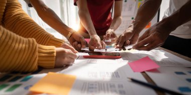 Brainstorm team of creative Web Graphic Designer planning, Group of asia mobile phone app developer team meeting for share ideas about screen prototype layout for smartphone, ui, ux startup small