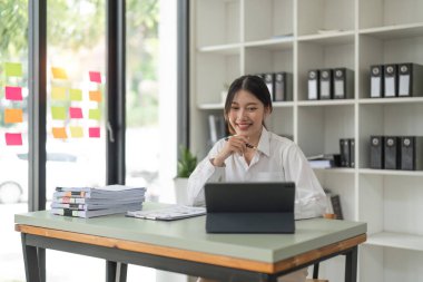 Accountant woman working on laptop and do document, tax, exchange, accounting and Financial advisor concept.