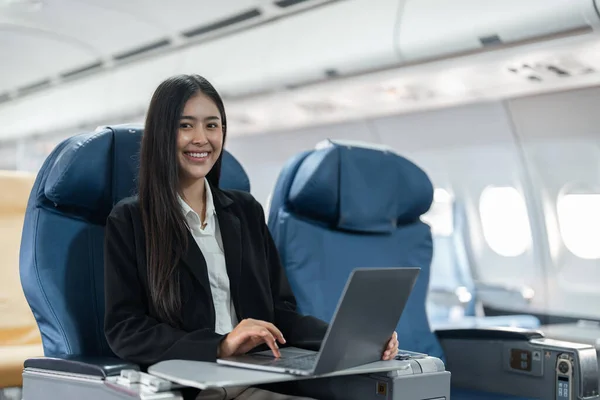 Female Passenger Sitting Plane While Working Laptop Computer Simulated Space — Stock Photo, Image