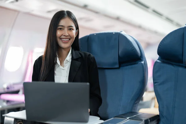 Female Passenger Sitting Plane While Working Laptop Computer Simulated Space — Stock Photo, Image