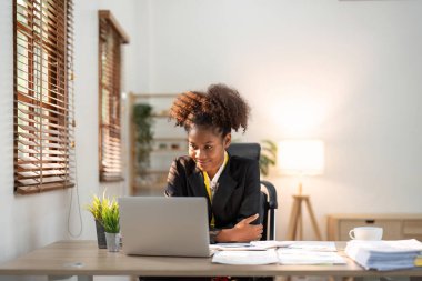 Accountant black woman working on laptop and do document, tax, exchange, accounting and Financial advisor concept.