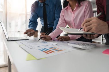 Intelligence analysis concept, group of business people brainstorm discussing current finance and economy on company investment laptop at meeting.