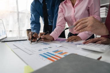 Intelligence analysis concept, group of business people brainstorm discussing current finance and economy on company investment laptop at meeting.
