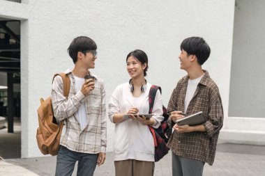 Education, friends and college with students on campus with books for learning, scholarship or knowledge. Study, future or university with people walking to class for back to school, academy or exam.