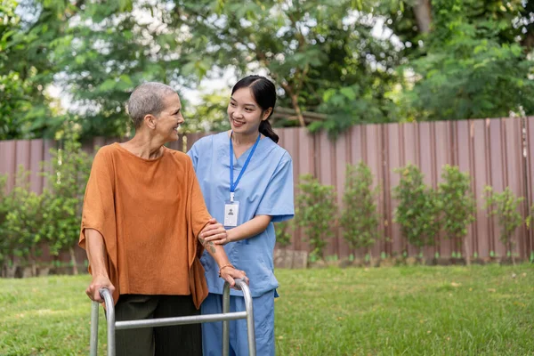 Nurse or caregiver and elderly woman support, healthcare service and health portrait at home. Medical physiotherapy, doctor helping and elderly patient with disability in home.