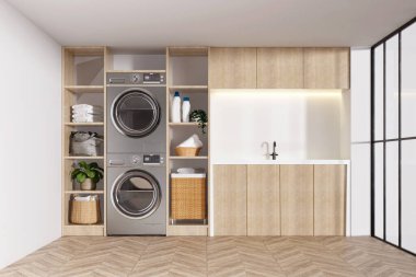 İyi organize edilmiş çamaşır odası entegre çamaşır makineleri, depolama birimleri ve verimlilik için parlak bir tasarım..