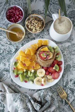 Pancakes with fresh fruit. Fruit salad with gluten-free pancakes. Healthy breakfast full of vitamins