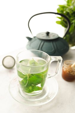 Tea with fresh mint leaves. Mint infusion helps with digestive problems