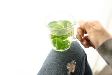 Tea with fresh mint leaves. Mint infusion helps with digestive problems