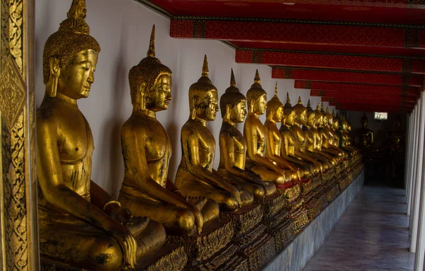Wat Pho, the Temple of the Reclining Buddha, is a stunning temple in Bangkok known for its giant reclining Buddha statue, beautiful architecture, and intricate murals.Buddha Golden Statue .