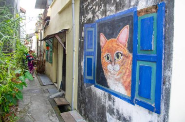 24 Şubat 2023 - George Town Penang-Malezya Ernest Zacharevic 'in Malezya' daki eski George Town kasabasının duvarlarındaki ünlü duvar resimlerinden biri..