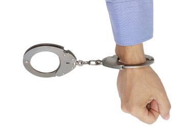 hand buckled in handcuffs, on an isolated white background clipart
