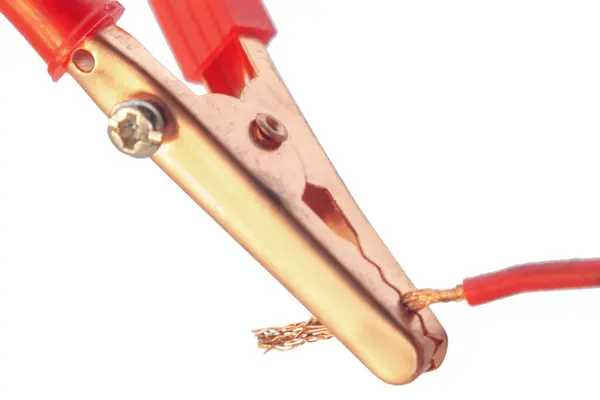 stock image Red clamp attached to bare wire, macro, cut out