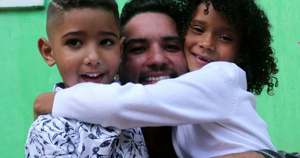 Father and children embrace, real love and affection. South american latin people