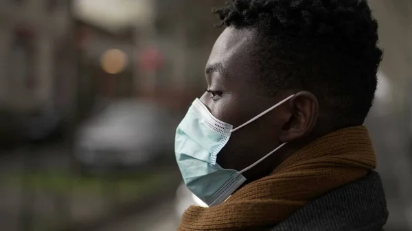 African Man Adjusting Covid Face Mask While Crossing Street City — Stockfoto