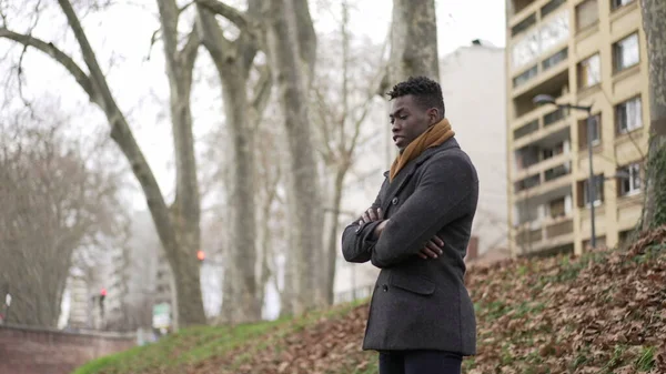 Black Man Arms Crossed Standing Park Thinking Wearing Winter Coat — Stok fotoğraf