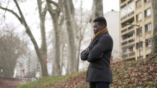 Black Man Arms Crossed Standing Park Thinking Wearing Winter Coat — ストック写真
