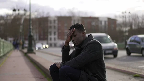 Anxious Black Man Sitting Sidewalk Feeling Worried — Zdjęcie stockowe