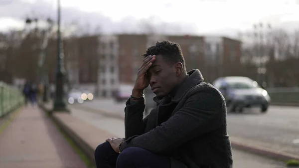 Anxious Black Man Sitting Sidewalk Feeling Worried — Stock Fotó