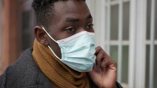 Black Man Putting Covid Face Mask While Walking City Cold — Foto de Stock