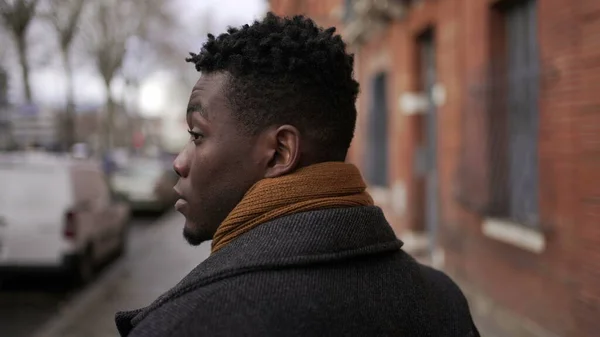 Black Man Walking Outdoors City Sidewalk Winter Back African Person — стокове фото