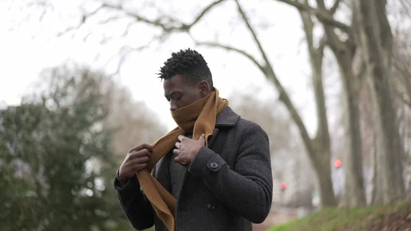 Black Man Putting Scarf Outdoors Winter Season African Guy Adjusting — стоковое фото