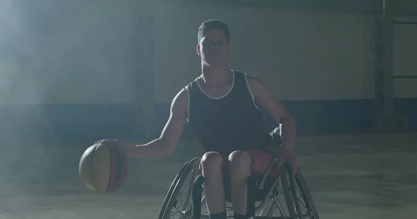 stock image Portrait of a Brazilian paraplegic disabled athlete on wheelchair playing basketball inside sport court looking at camera