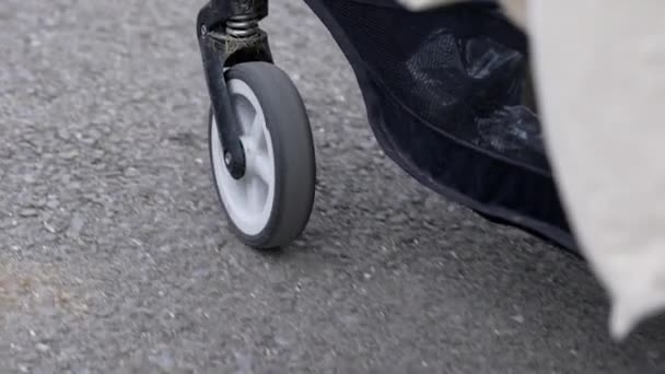 Stroller Wheel Motion Parent Pushing Baby Carriage Closeup Wheels — Stock Video