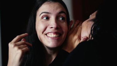 Woman reaction to SURPRISE to gossip news by female friend whispering SECRET with SHOCK. Person revealing unbelievable NEWS