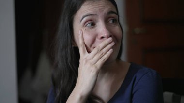 Woman reacting with surprise and unbelief to news told by friend. Person closeup face emotional reaction with consternation