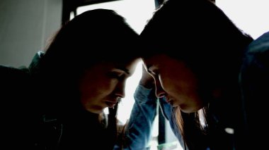 Woman looking at mirror reflection facing your fears concept