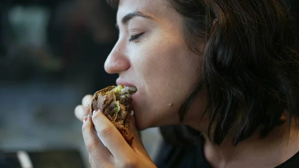 Hispanic Woman Taking Bite Burger Latina American Girl Eating Cheeseburger — Zdjęcie stockowe