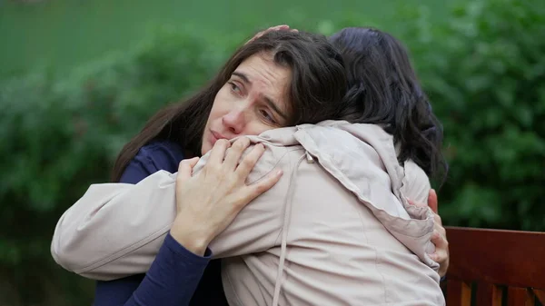 Sad woman suffering from negative emotion. Two women embracing each other with EMPATHY