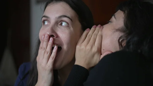 Friend Telling Secret Woman Ear Whispering Young Woman Shock Surprise — Stockfoto