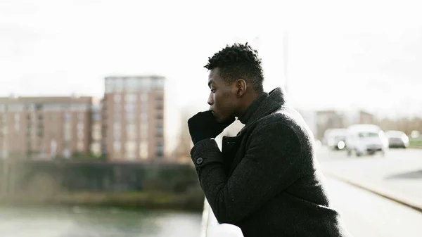 Elegant Contemplative African Man Looking Horizon Wearing Winter Clothes — Stock Fotó