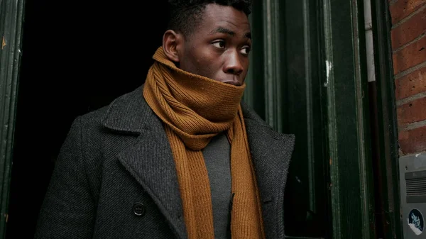 Elegant Black Man Opening Home Door Steps Cold Adjusting Clothes — Stok fotoğraf