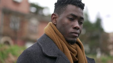 Pensive black African man close-up face thinking about issues