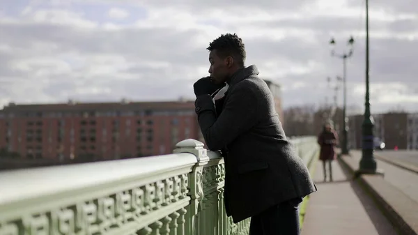 Pensive Black African Man Standing Bridge Thinking Life Looking Horizon — Stockfoto
